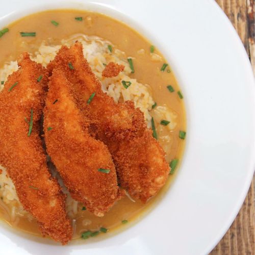 Breaded chicken homemade dish served as main in wedding breakfast